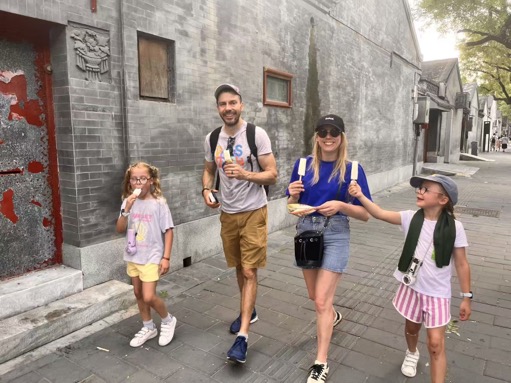 Jeff with travelers on a local street