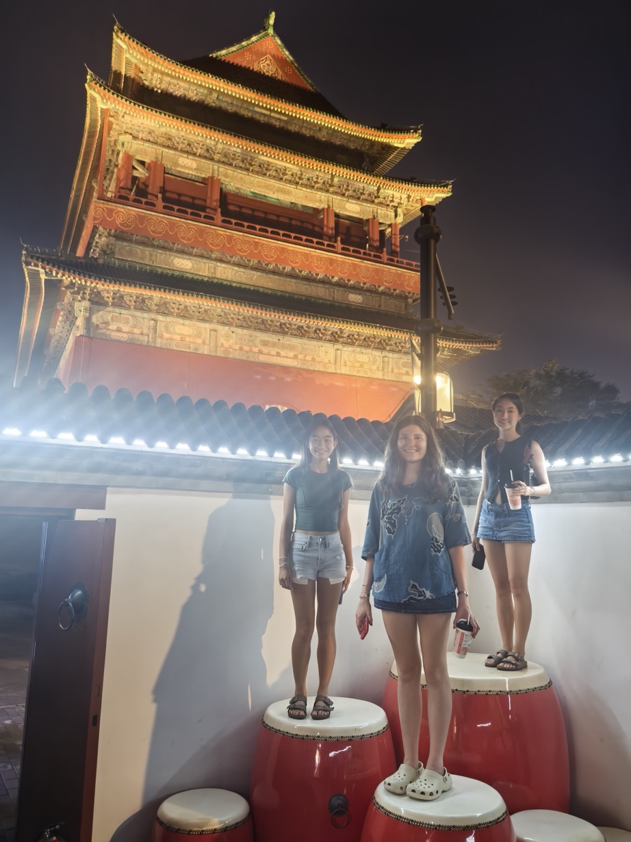 Travelers enjoying an evening near the Drum Tower